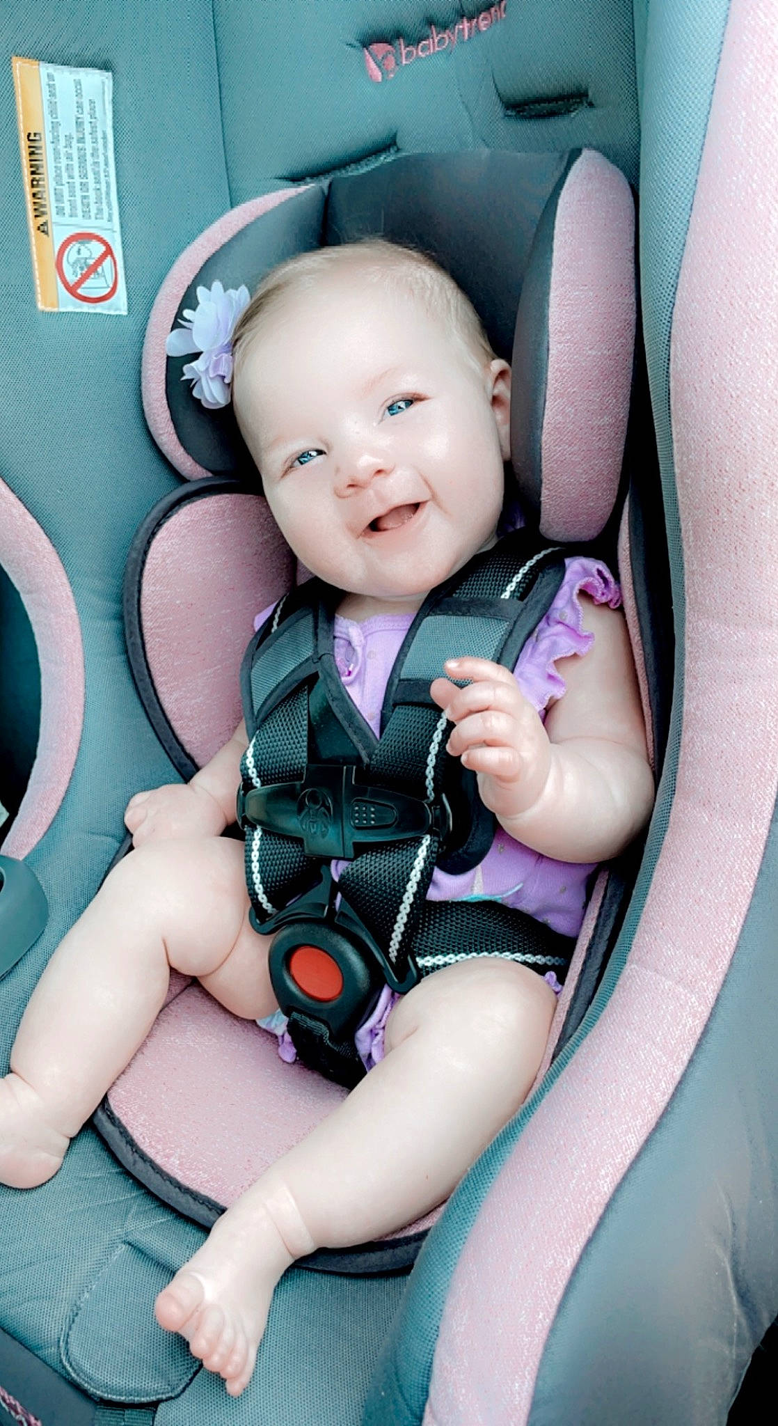 Raelynn is registered to the contest to win money with this photo: arm, auto_part, automotive_design, baby, baby_in_car_seat, baby_safety, baby_toddler_clothing, car_seat, child, comfort, fun, happy, leg, person, seat_belt, sitting, smile, thigh, thumb, toddler