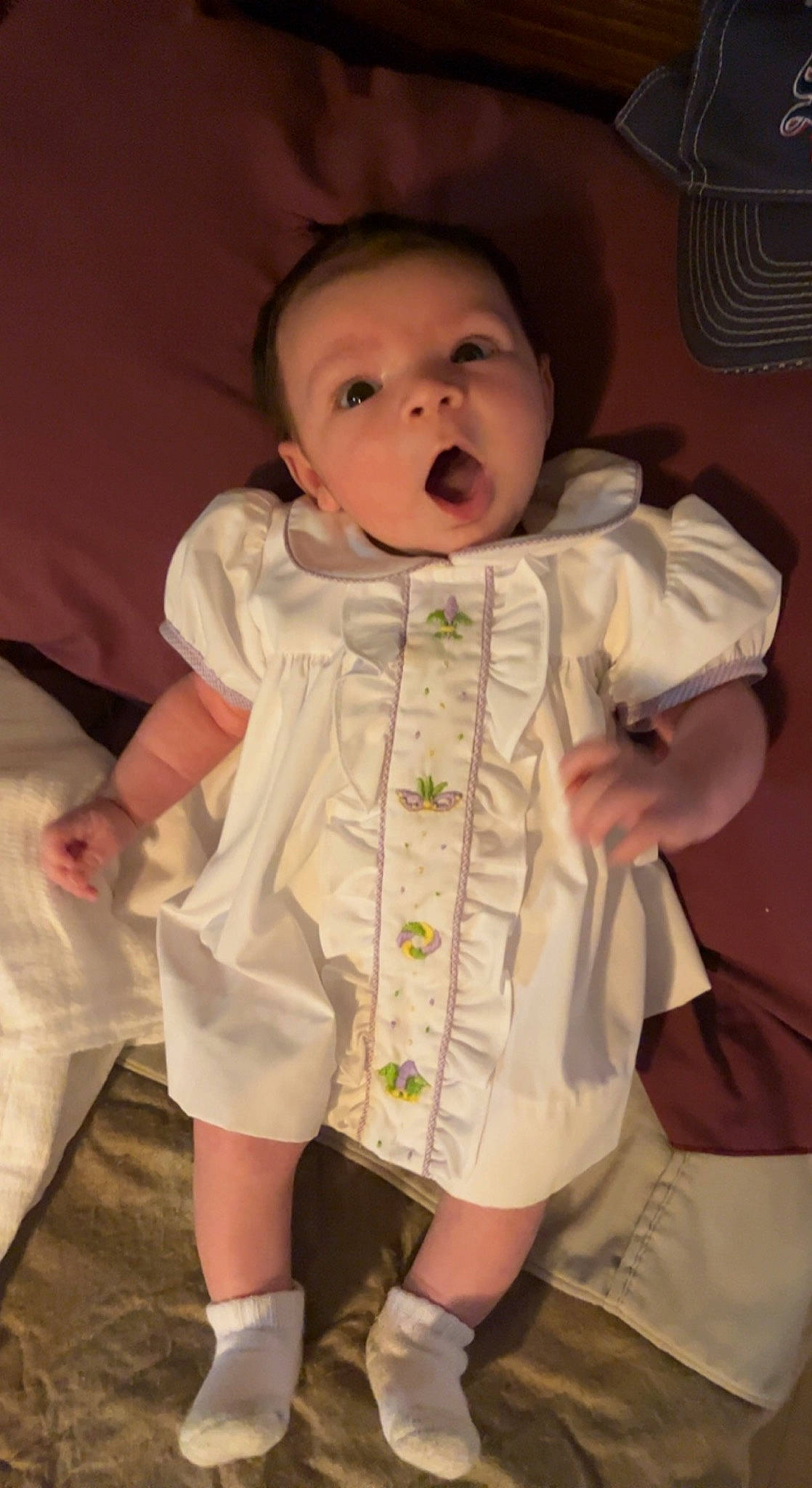 Kohen is registered to the contest to win money with this photo: baby, baby_products, baby_toddler_clothing, cheek, collar, comfort, dress, dress_shirt, eye, face, gesture, head, human_body, iris, nose, person, pink, skin, sleeve, thumb