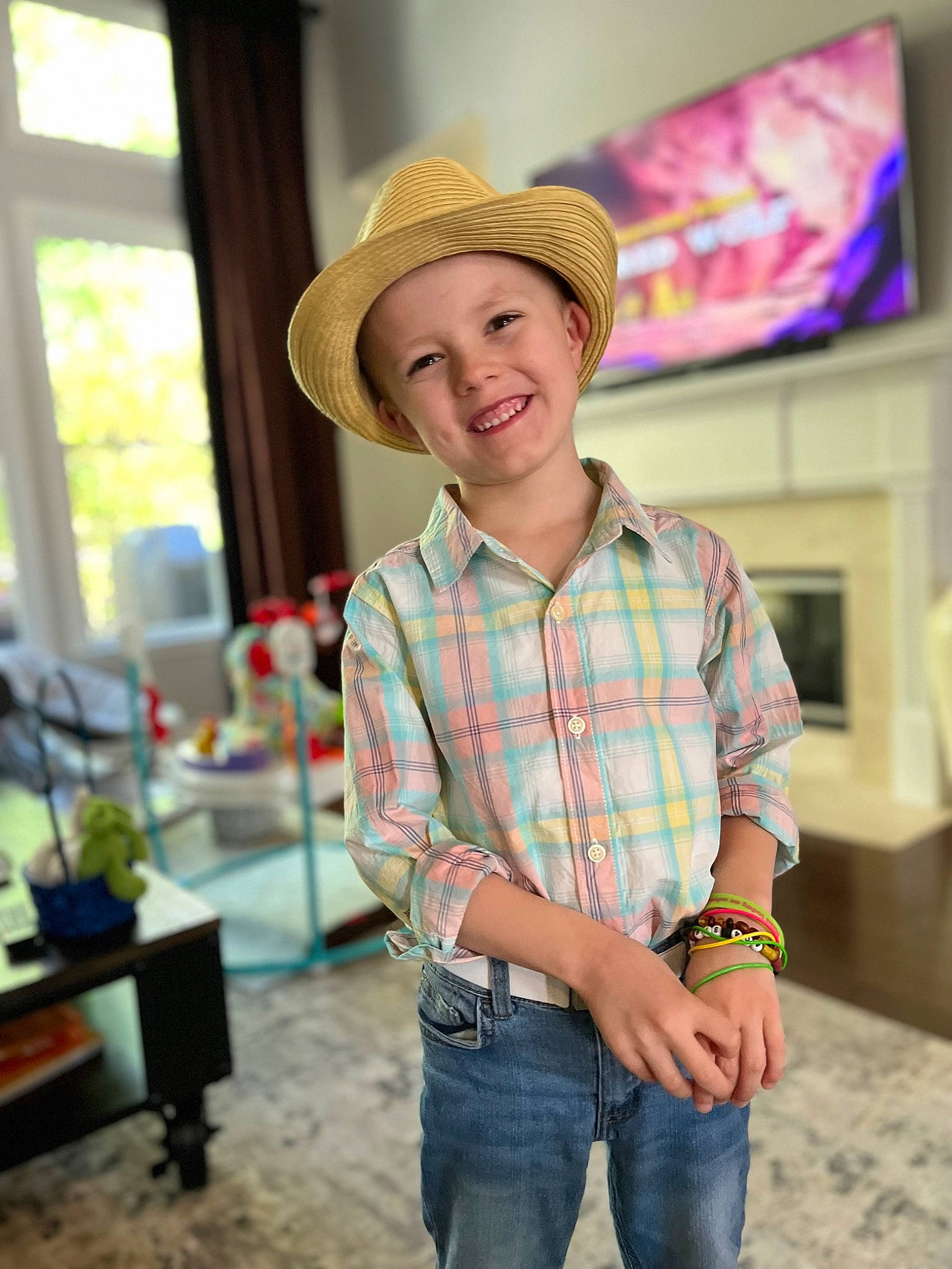 Dylan is registered to the contest to win money with this photo: child, cool, denim, dress_shirt, fun, hairstyle, happy, hat, headwear, jeans, joy, leisure, neck, pattern, person, plaid, plant, sleeve, smile, sun_hat