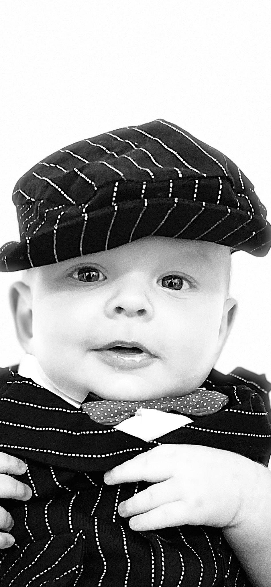 Rowen is registered to the contest to win money with this photo: art, baby, black, black_and_white, cap, child, chin, cool, costume_hat, eyebrow, facial_expression, hairstyle, hat, headgear, headwear, outerwear, person, photograph, sleeve, style