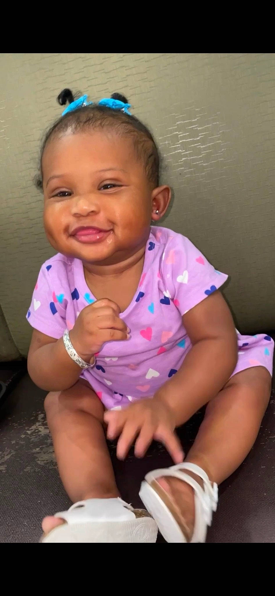 Lailyn is registered to the contest to win money with this photo: arm, baby_toddler_clothing, blue, cheek, chin, clothing, eyebrow, forehead, hair, hand, happy, joy, lip, mouth, neck, nose, person, purple, skin, sleeve