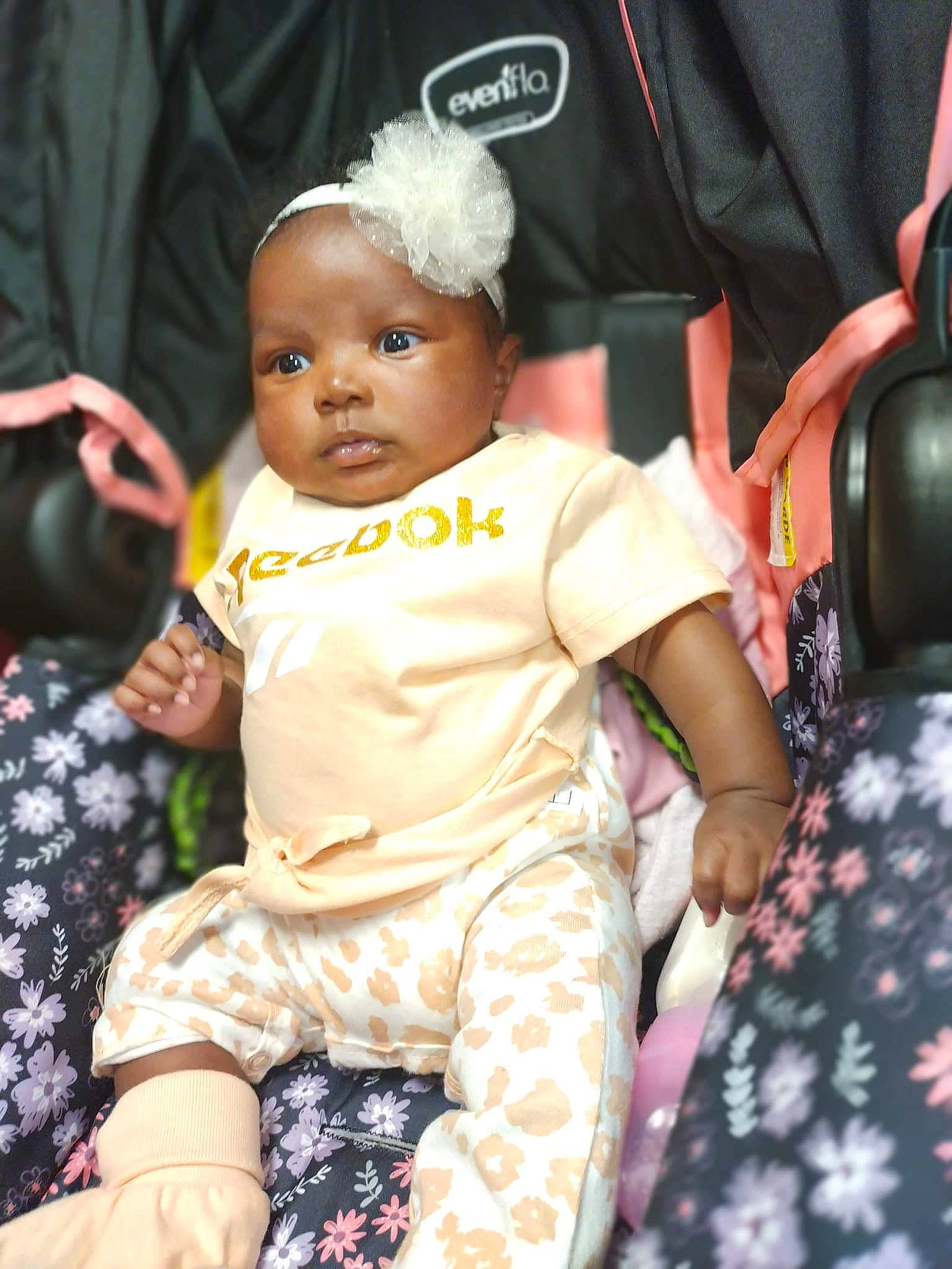 Amiri is registered to the contest to win money with this photo: baby, baby_products, baby_toddler_clothing, beauty, child, event, facial_expression, flash_photography, fun, hairstyle, happy, jewellery, magenta, pattern, person, pink, purple, sitting, skin, toddler