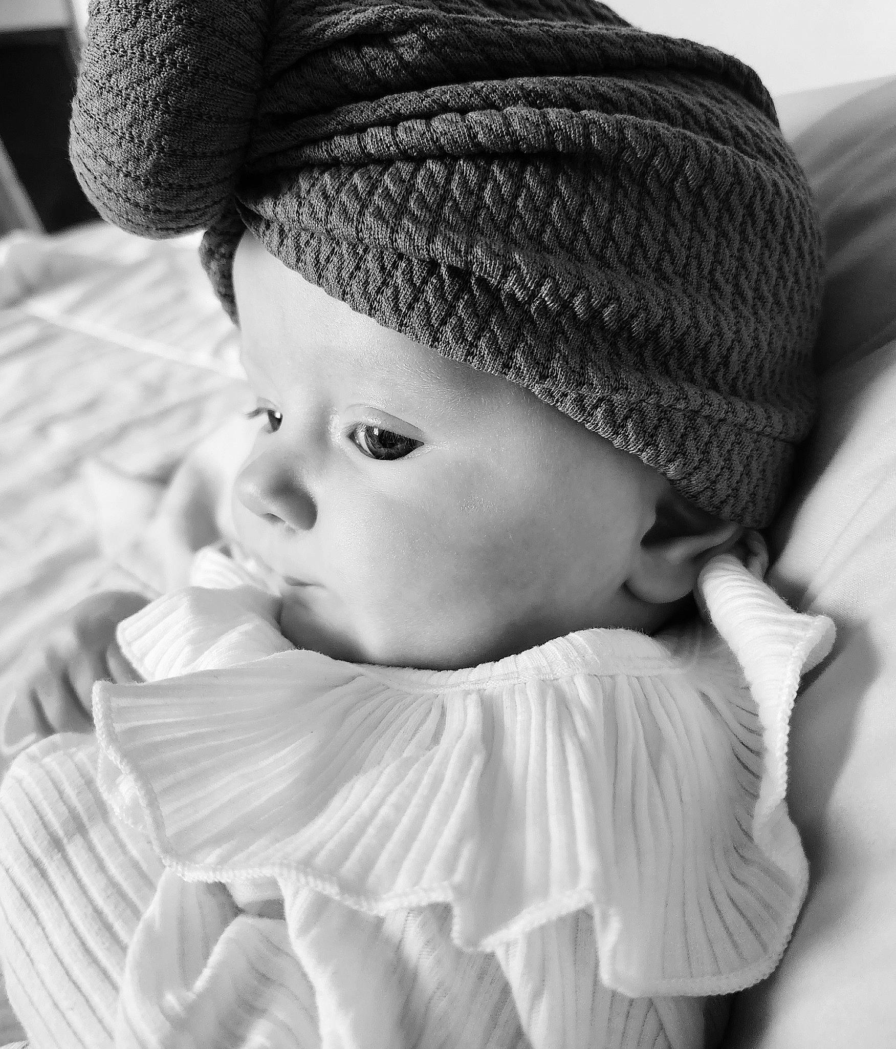 Montana is registered to the contest to win money with this photo: baby, baby_toddler_clothing, beauty, black, cap, cheek, comfort, eye, face, flash_photography, grass, happy, headgear, lip, organ, person, photograph, skin, style, toddler