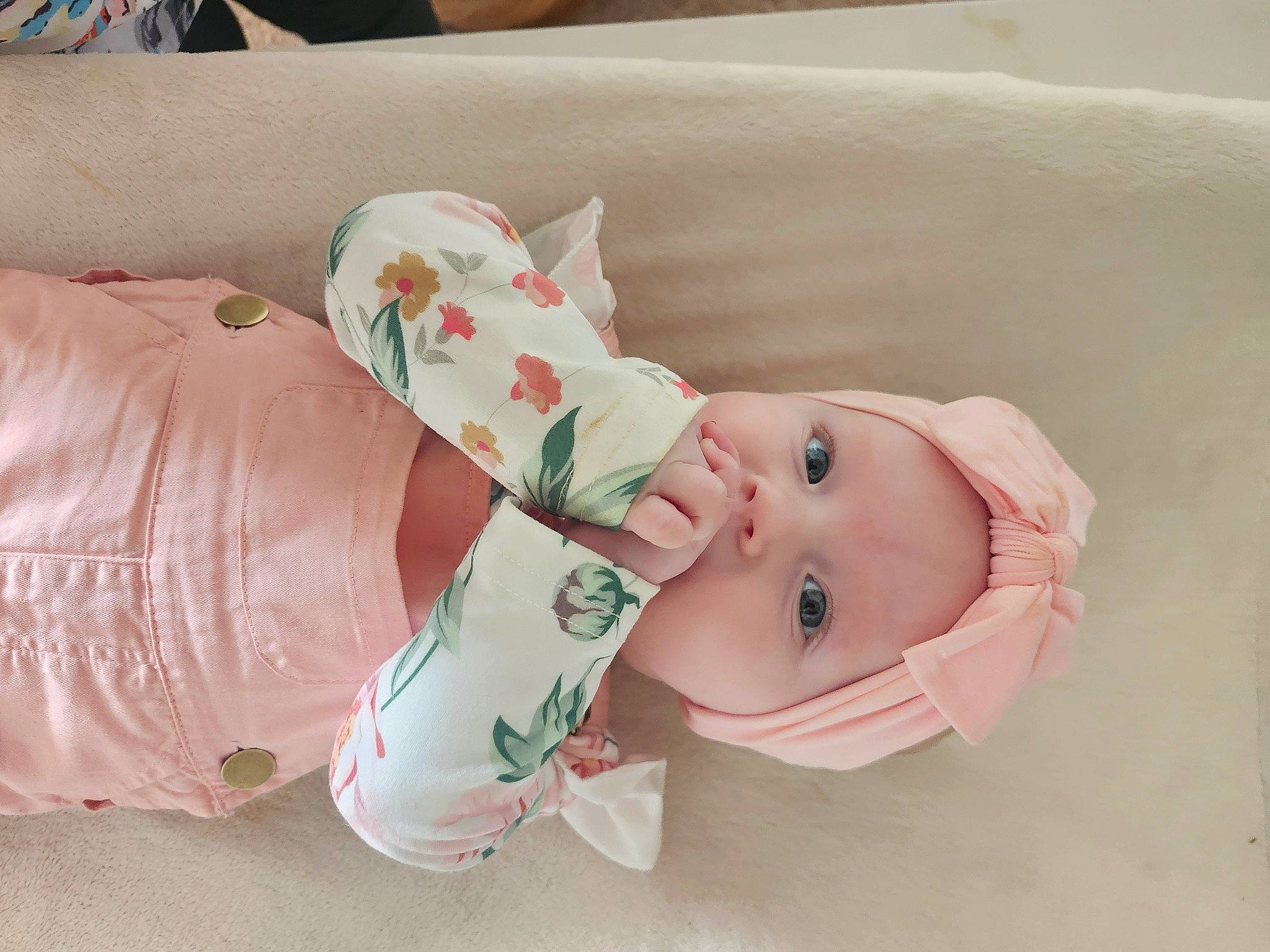Montana is registered to the contest to win money with this photo: baby, baby_products, baby_toddler_clothing, carmine, child, comfort, dress, fashion_accessory, happy, hat, headwear, linens, pattern, person, room, sleeve, sock, toddler