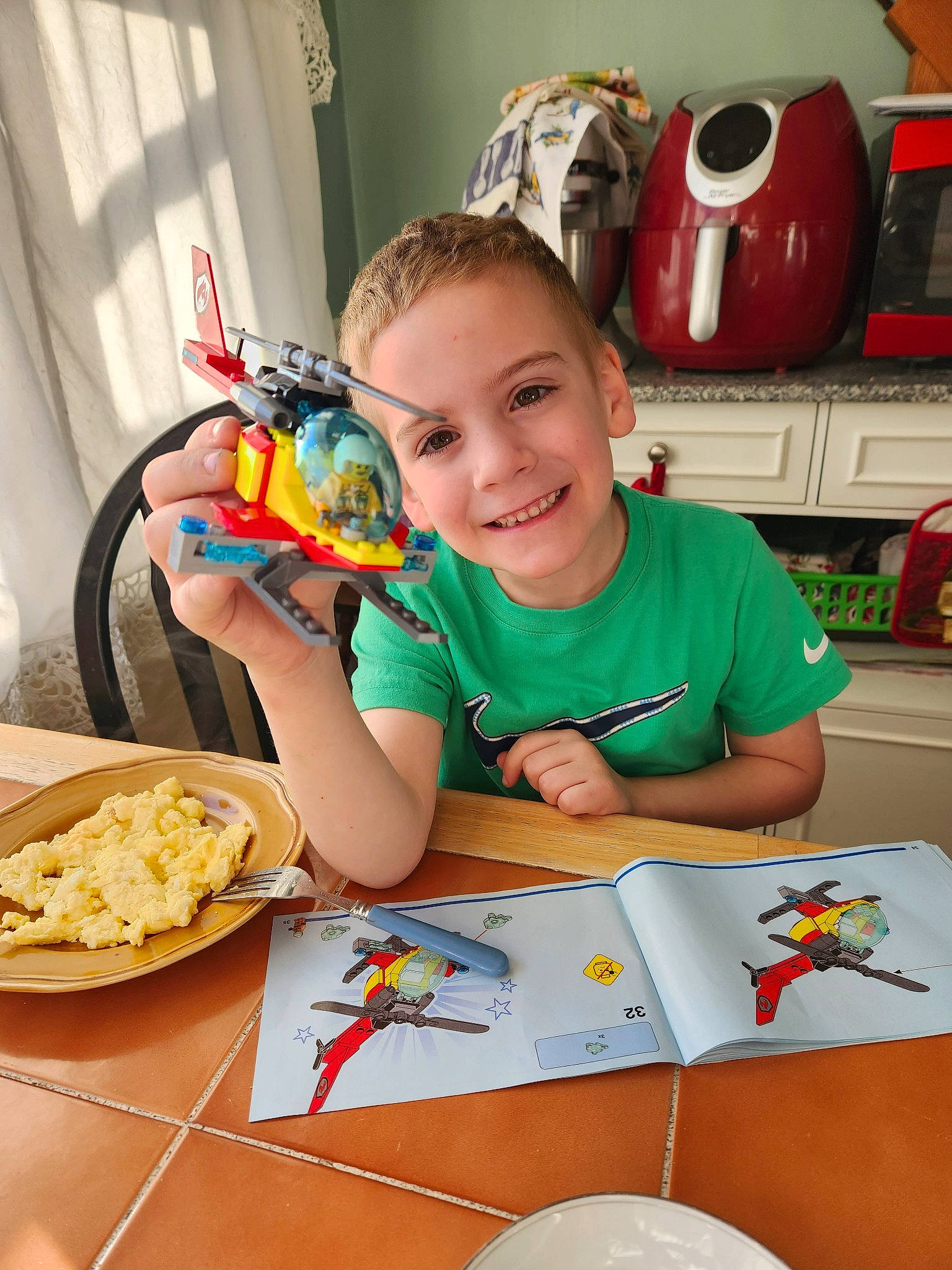 Garrett joined the competition — help win amazing prizes! chair, child, comfort_food, cooking, dish, event, finger_food, food, fun, happy, ingredient, joy, leisure, person, plate, recipe, sharing, smile, t_shirt, table