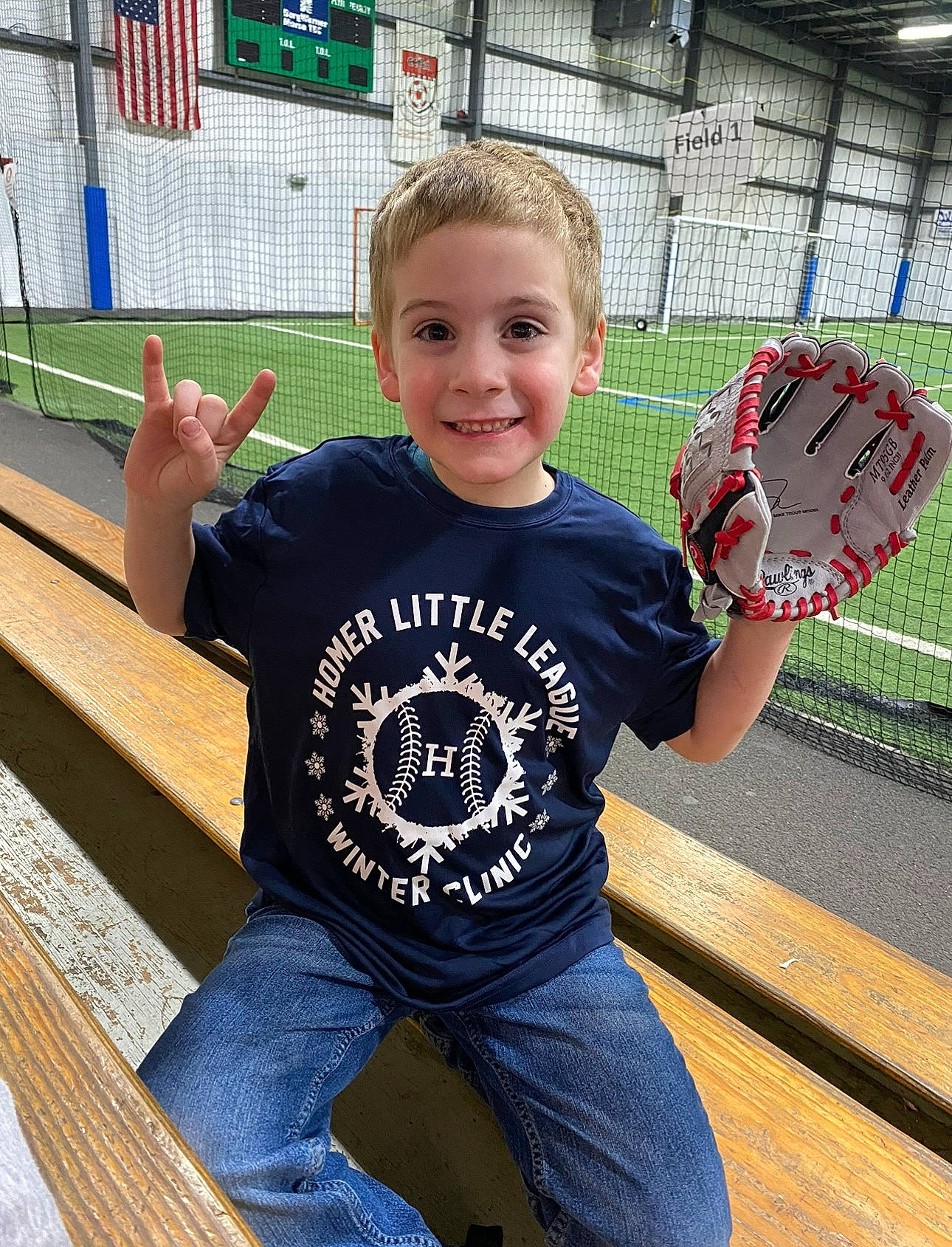 Garrett is registered to the contest to win money with this photo: child, denim, electric_blue, fun, grass, happy, jeans, joy, leisure, pattern, person, play, player, recreation, sitting, sleeve, smile, sports_equipment, sportswear, t_shirt