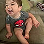 toddler, child, smiling, laughing, couch, indoor, clothing, onesie, spiderman, happy, person, baby, seat, furniture, cute, skin, head, hair, hand, foot