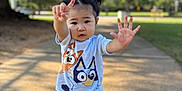 Anaia Amari joined the competition — help win amazing prizes! toddler, child, pigtails, outdoor, sunlight, cartoon_clothing, playful_pose, sidewalk, tree, greenery, shoes, casual_wear, young_child, person, cute, smiling, daylight, nature, fun, park