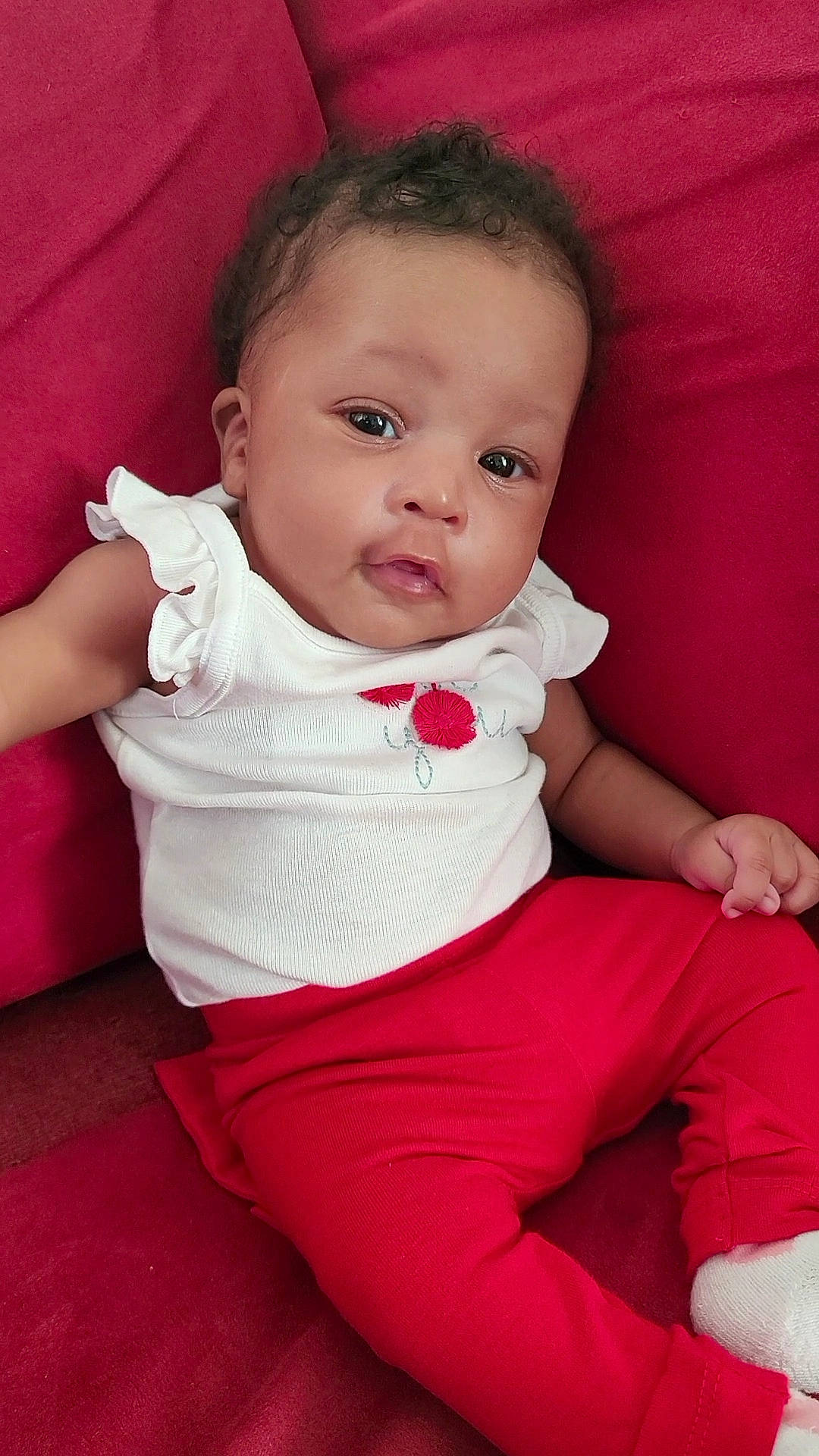 Mi'Liyah is registered to the contest to win money with this photo: baby, baby_toddler_clothing, cheek, child, collar, comfort, elbow, face, finger, flash_photography, hand, joint, lip, neck, pattern, person, pink, shoulder, skin, sleeve