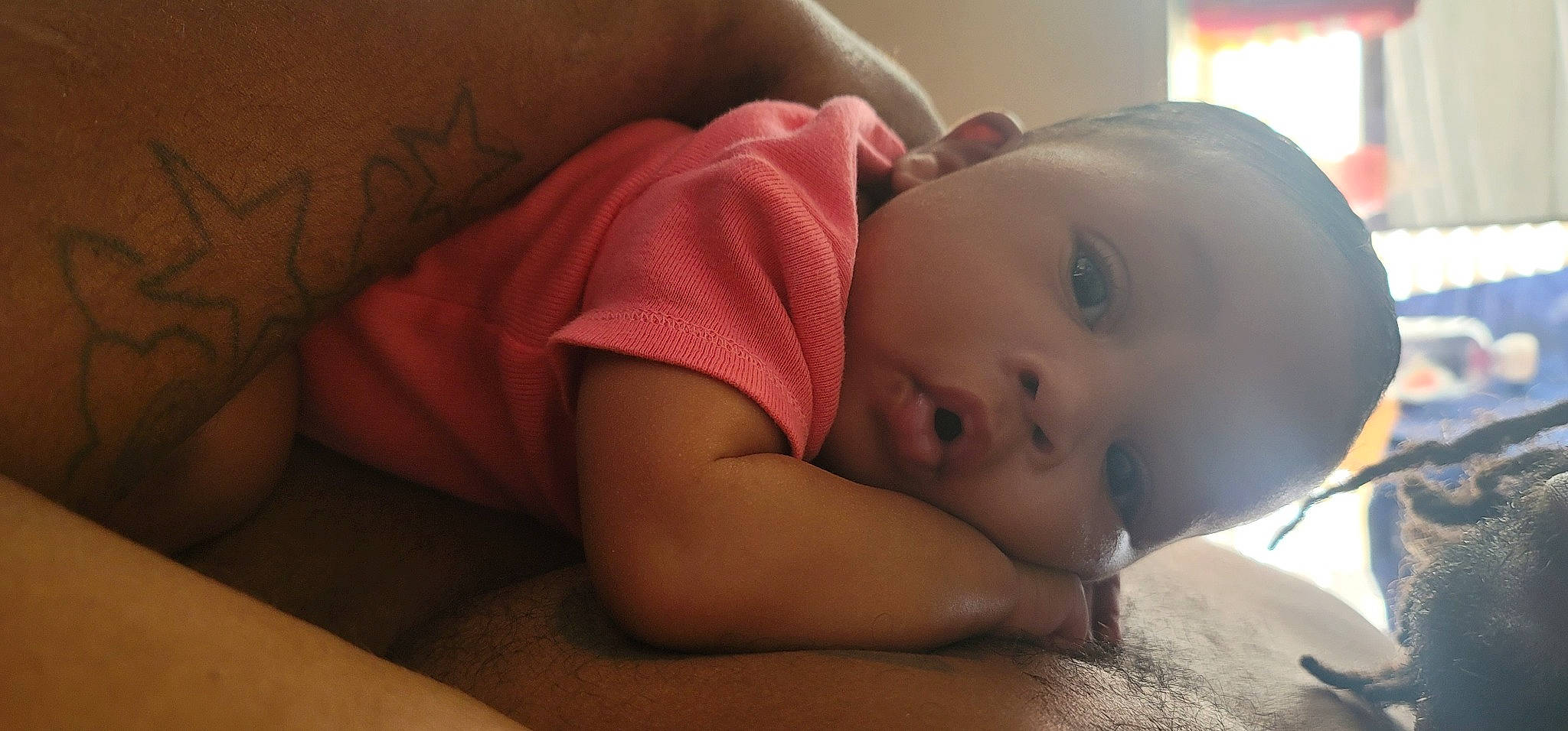 Mi'Liyah is registered to the contest to win money with this photo: baby, baby_toddler_clothing, cheek, child, comfort, ear, eyebrow, eyelash, finger, flash_photography, flooring, human_body, iris, lip, mouth, nose, person, room, skin, toddler