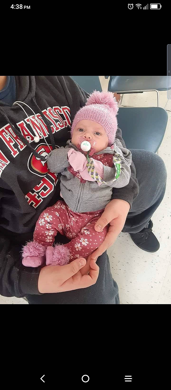 Thea is registered to the contest to win money with this photo: baby, baby_products, baby_toddler_clothing, cap, car_seat, carmine, doll, fictional_character, fur, hat, headwear, lap, leg, magenta, person, pink, plush, sitting, sleeve, stuffed_toy
