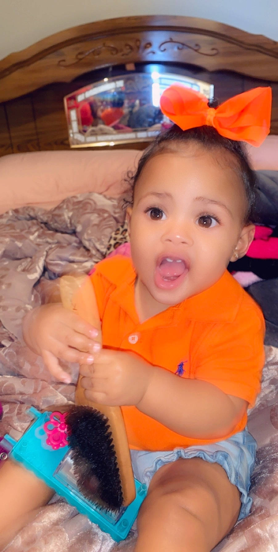 Brooklynn is registered to the contest to win money with this photo: baby, baby_products, baby_toys, cheek, child, ear, eye, finger, head, iris, mouth, nose, orange, person, play, product, skin, smile, surprise, thumb