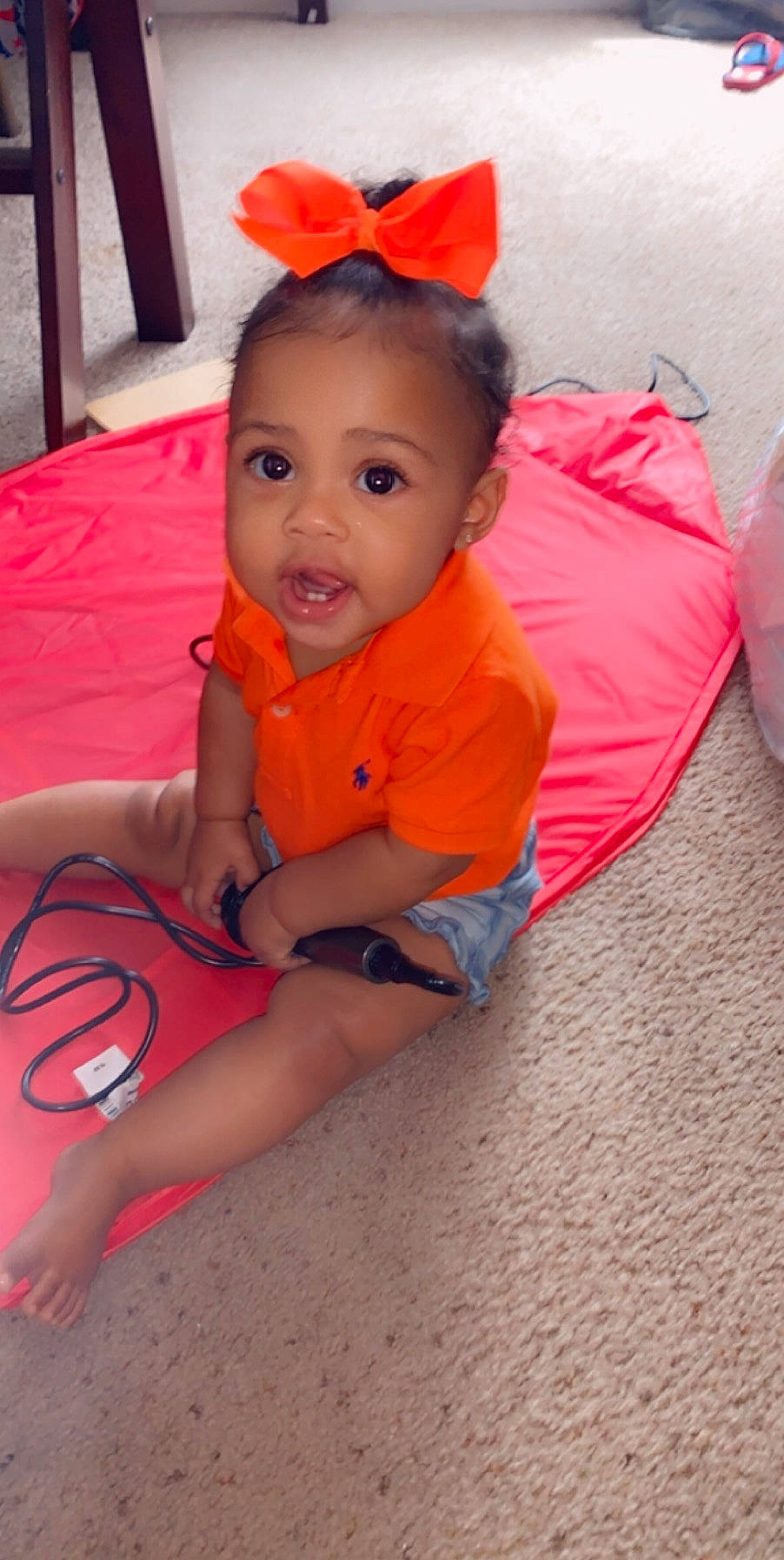 Brooklynn is registered to the contest to win money with this photo: baby, cheek, child, face, fun, head, leg, lip, mouth, neck, orange, person, pink, play, skin, surprise, toddler