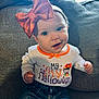 baby, bow, child, couch, cute, decoration, fabric, halloween, happy, headband, holiday, indoors, infant, jeans, orange, person, portrait, shirt, sitting, smiling