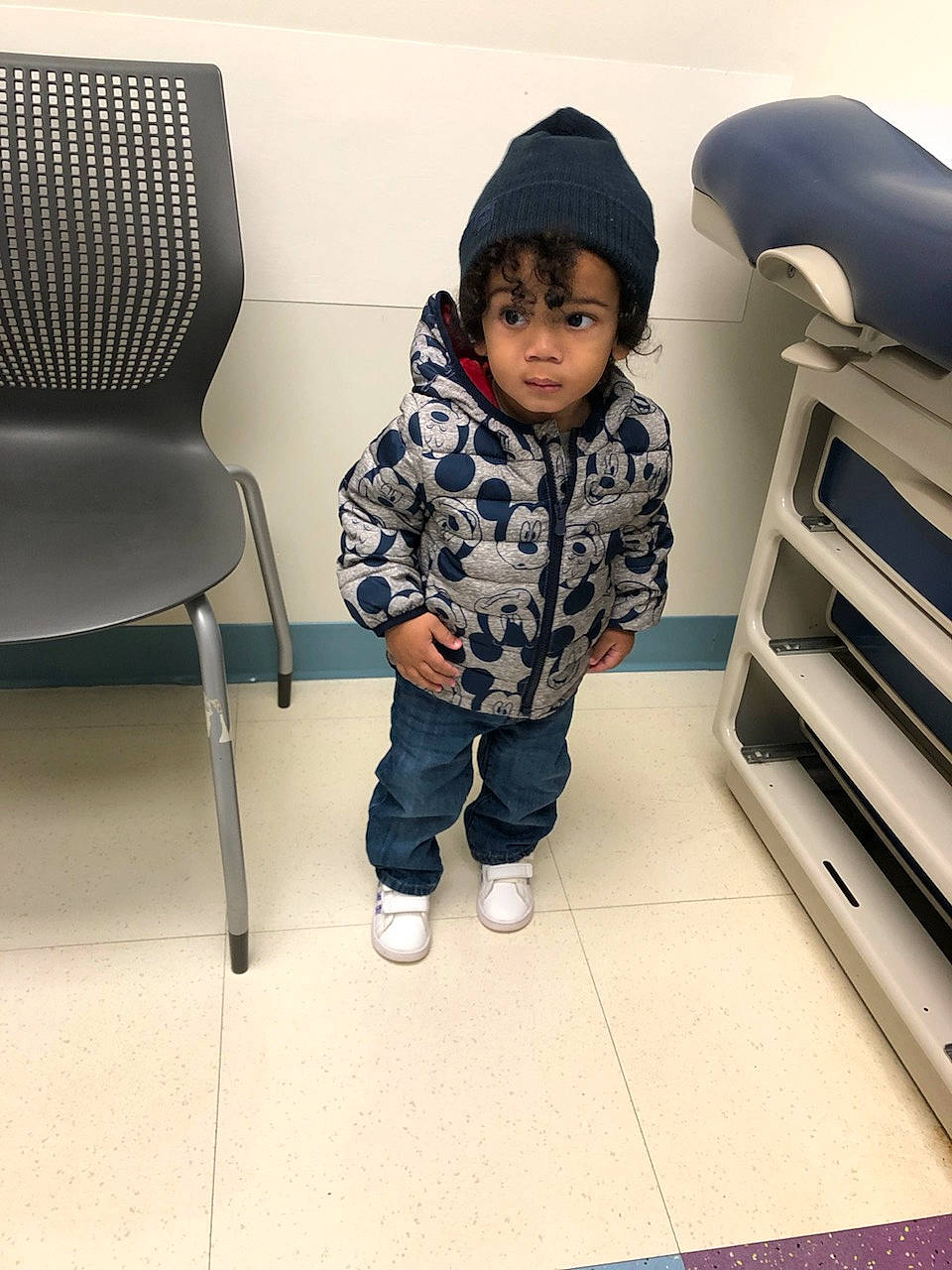 Amari joined the competition — help win amazing prizes! baby_toddler_clothing, cap, chair, child, comfort, electric_blue, floor, flooring, hood, hoodie, pattern, person, personal_protective_equipment, room, shoe, sitting, sleeve, sneakers, standing, t_shirt