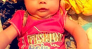Gracie is registered to the contest to win money with this photo: baby, blanket, bow, child, clothing, colorful, cute, expression, fabric, face, headband, indoors, infant, person, pink_clothing, portrait, sitting, sock, soft, young_child