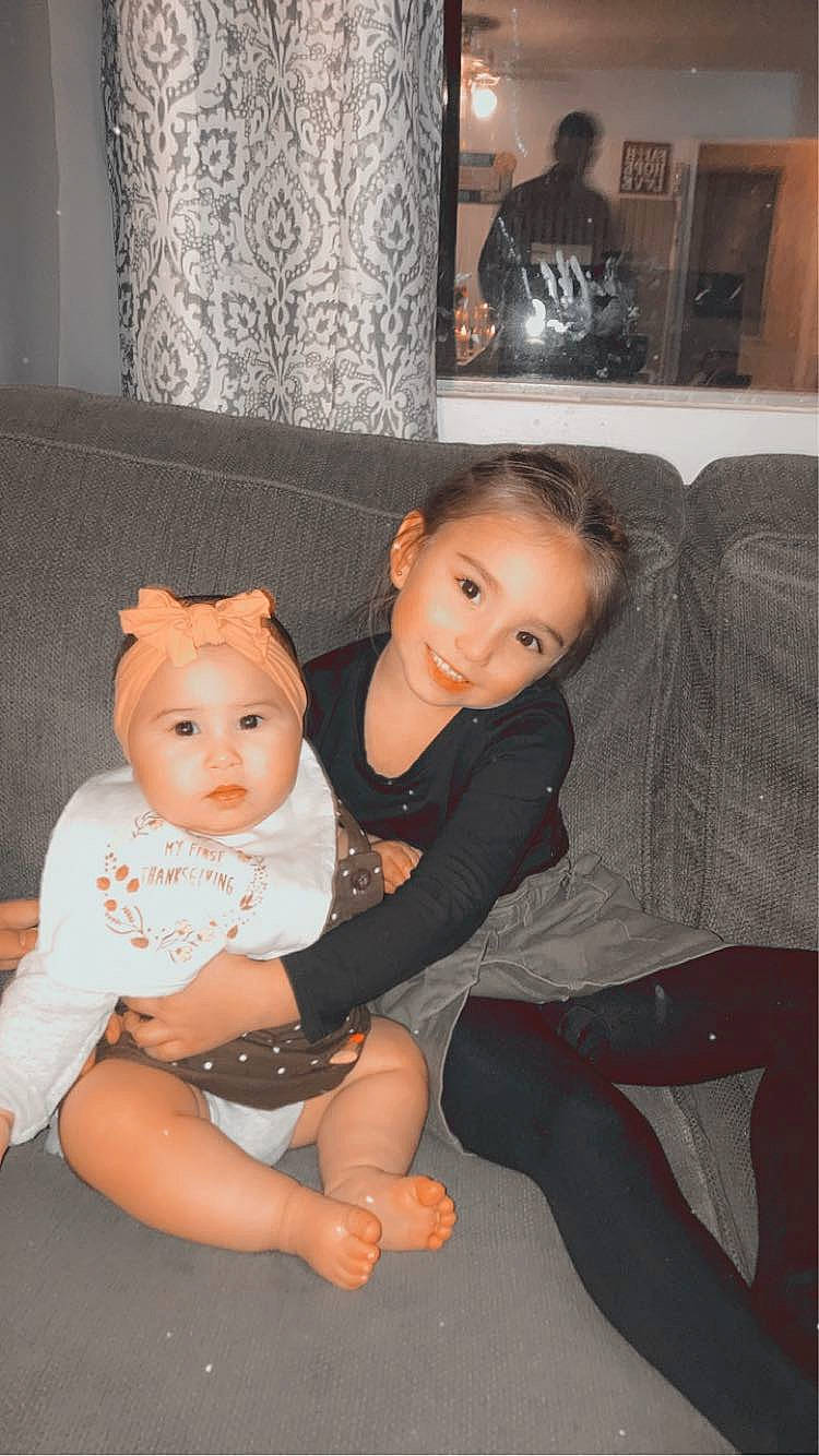 Kathleen joined the competition — help win amazing prizes! baby, baby_toddler_clothing, child, comfort, couch, event, flash_photography, floor, flooring, fun, hairstyle, happy, headwear, iris, joy, lap, leg, person, picture_frame, skin