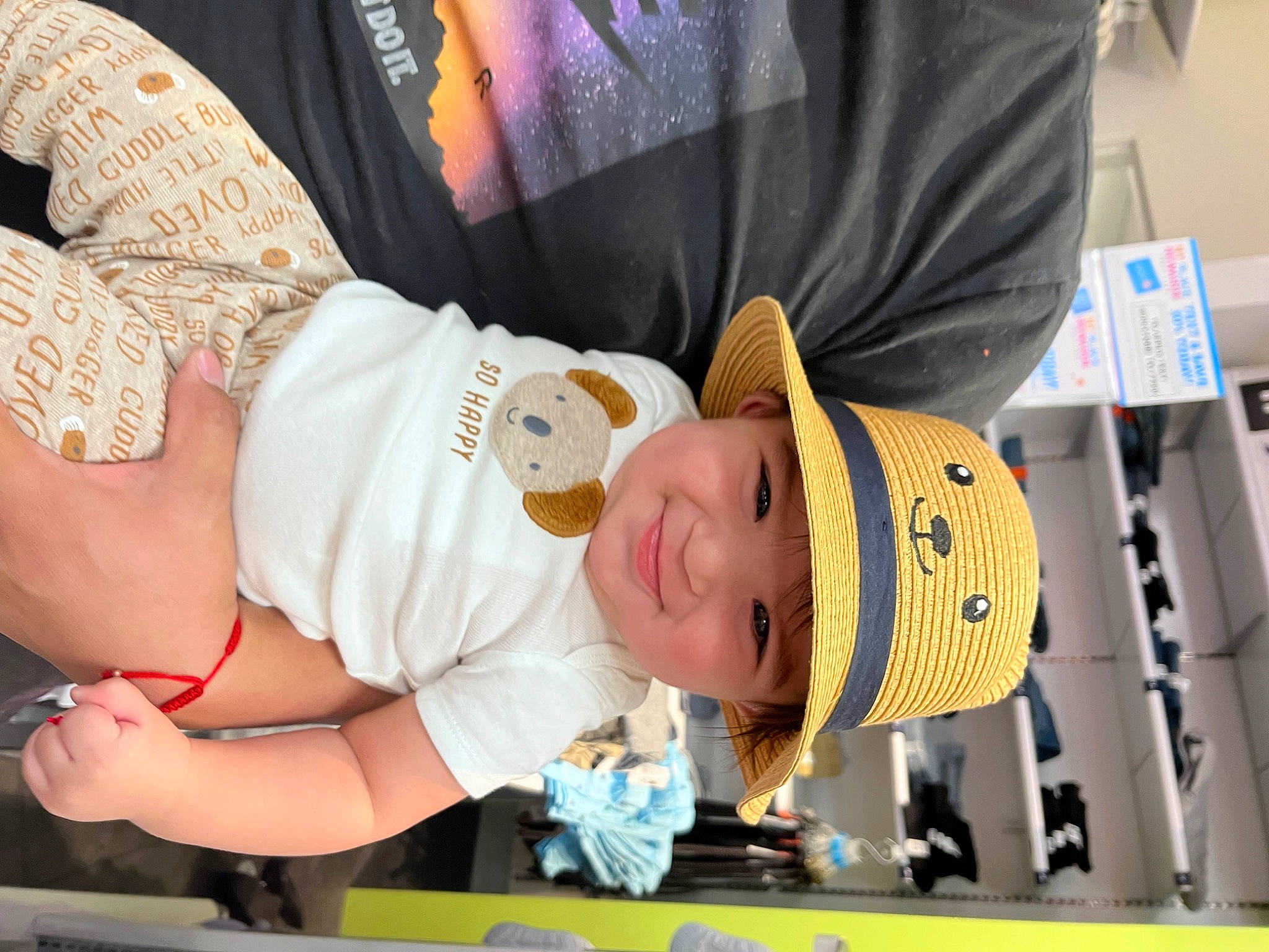 Martin is registered to the contest to win money with this photo: abdomen, baby, baby_toddler_clothing, cap, chest, child, costume_hat, elbow, event, fashion_accessory, fun, happy, hat, headgear, headwear, joy, person, personal_protective_equipment, room, sun_hat