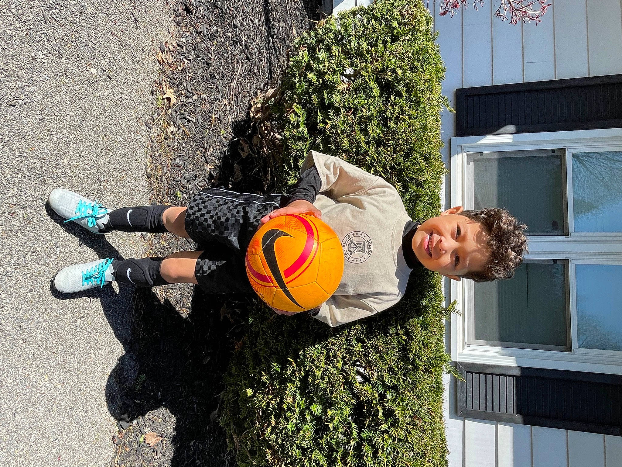 Sebastian joined the competition — help win amazing prizes! asphalt, ball, child, football, fun, grass, human_leg, joy, knee, leisure, people_in_nature, person, plant, player, road_surface, smile, soccer, soccer_ball, sports_equipment, team_sport