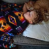 child, blanket, couch, cat, ginger_cat, sleeping, nap, pillow, curly_hair, indoor, rest, cozy, pet, friendship, warm, comfort, relaxation, furniture, home, snuggle