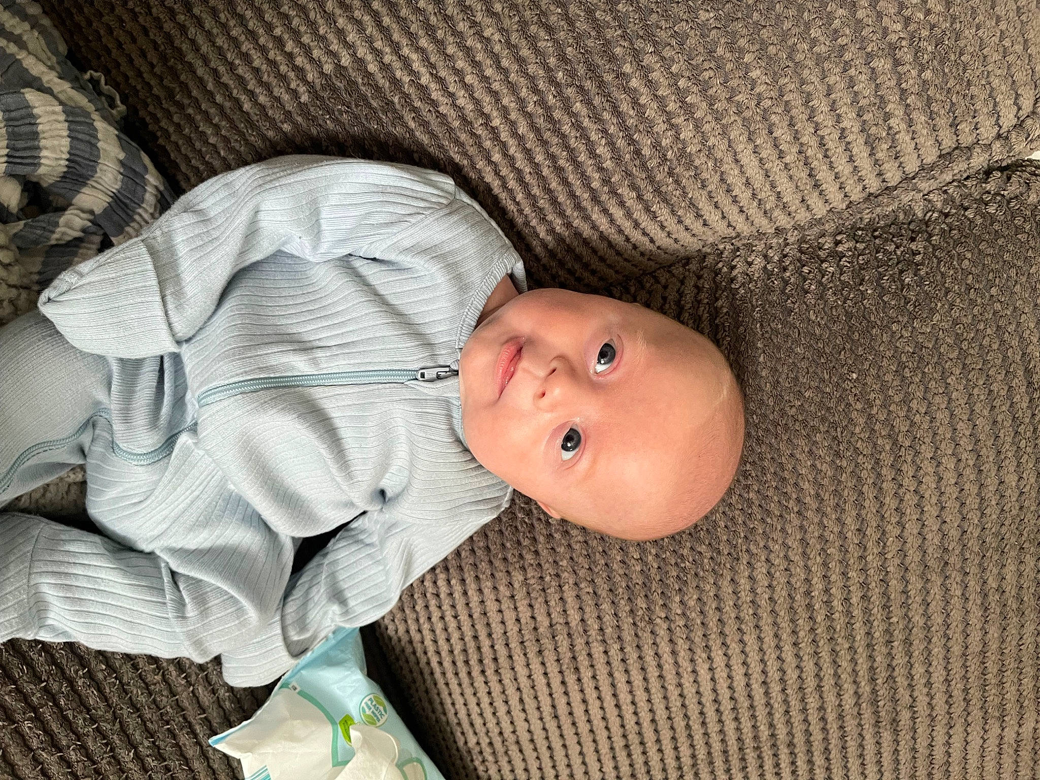 Brody is registered to the contest to win money with this photo: baby, baby_products, baby_safety, baby_sleeping, baby_toddler_clothing, child, comfort, eye, face, head, human_body, linens, nap, pattern, person, sleep, sleeve, toddler, wood