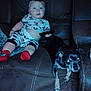 Amirion is registered to the contest to win money with this photo: animal, baby, black_dog, brown_couch, child, couch, curious, dog, flash, furniture, indoor, leather, mickey_mouse, pajamas, person, pet, relaxed, remote_control, socks, toddler