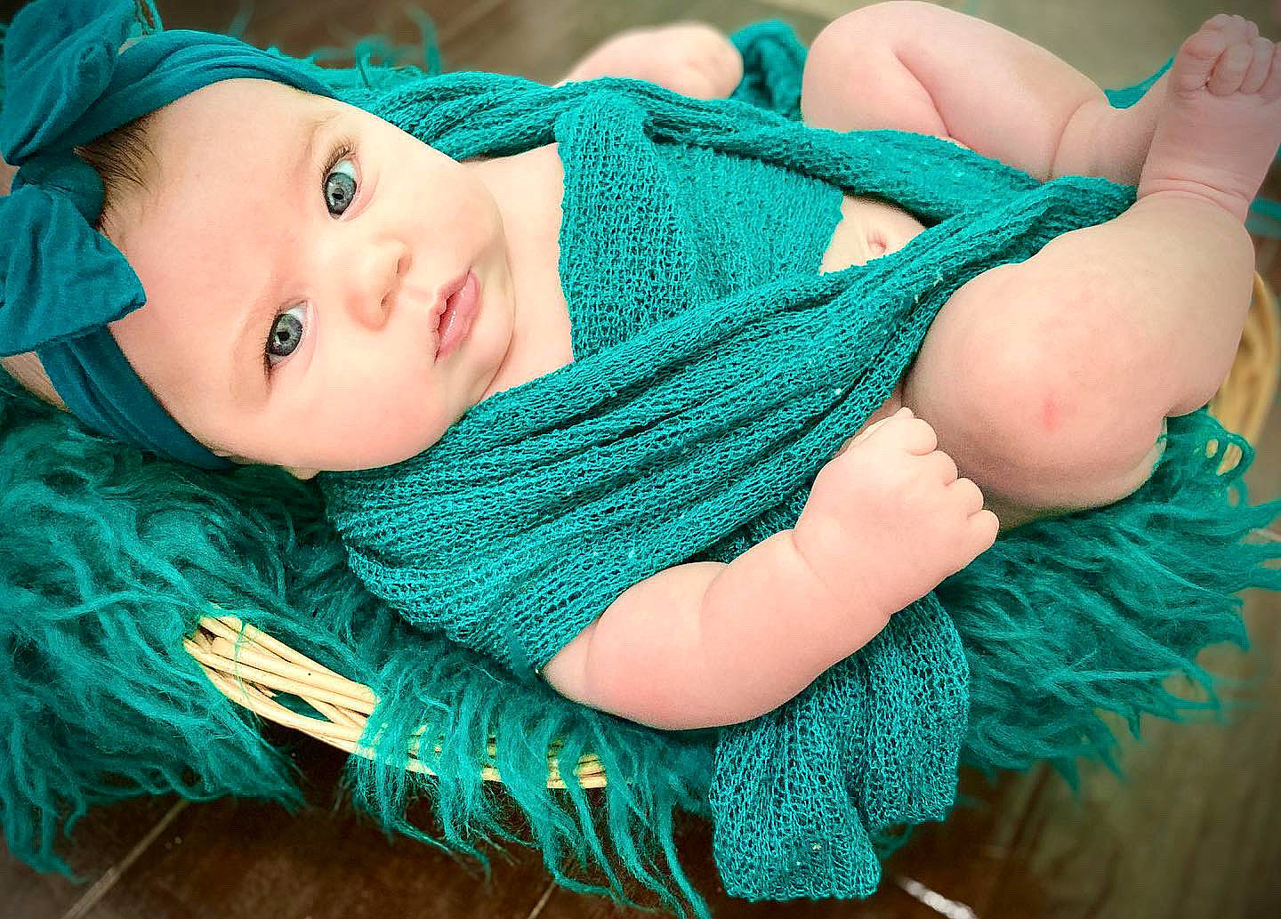 Lola joined the competition — help win amazing prizes! aqua, azure, baby, baby_products, baby_toddler_clothing, blue, child, electric_blue, grass, green, happy, headwear, pattern, person, pink, scarf, shawl, stole, textile, toddler