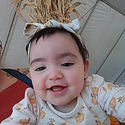 Katalayiah joined the competition — help win amazing prizes! baby, smiling, headband, pumpkin_pattern, fall_theme, dried_corn_stalks, tent, child, cute, portrait, infant, clothing, happy, face, person, closeup, celebration, festive, autumn, indoors