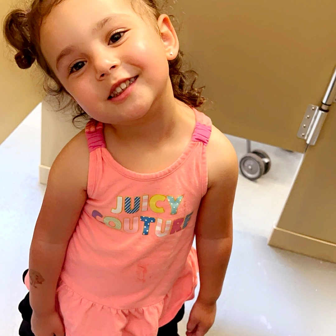 Sianni joined the competition — help win amazing prizes! bodypart, child, clothing, dress, face, female, footwear, girl, happy, head, indoors, mouth, pants, person, photography, portrait, sandal, shoe, shorts, smile