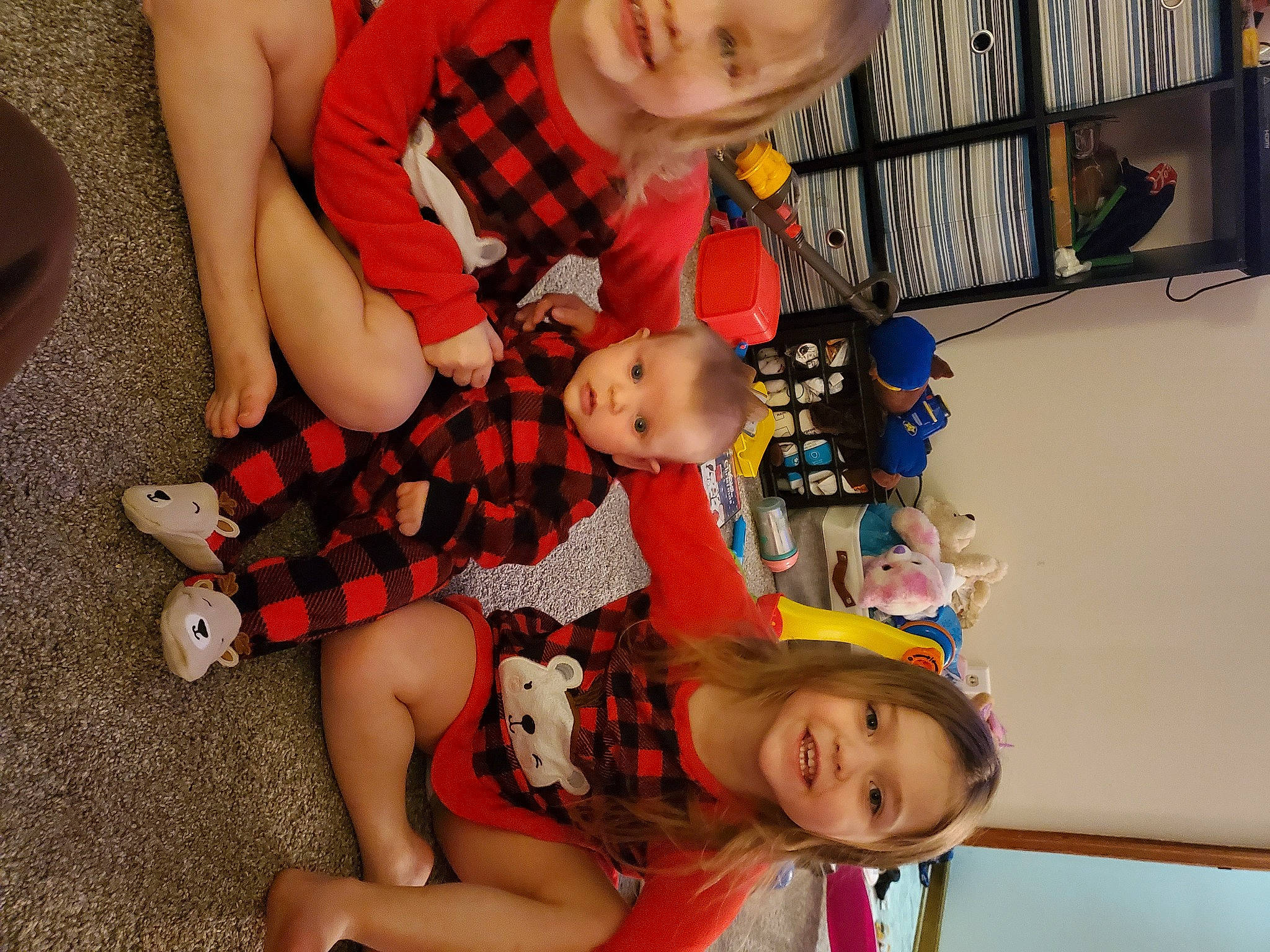 Emmalee is registered to the contest to win money with this photo: baby, baby_products, baby_toddler_clothing, baby_toys, child, eye, face, foot, head, human, joy, lap, mouth, nose, person, plush, shelf, sock, stuffed_toy, toddler