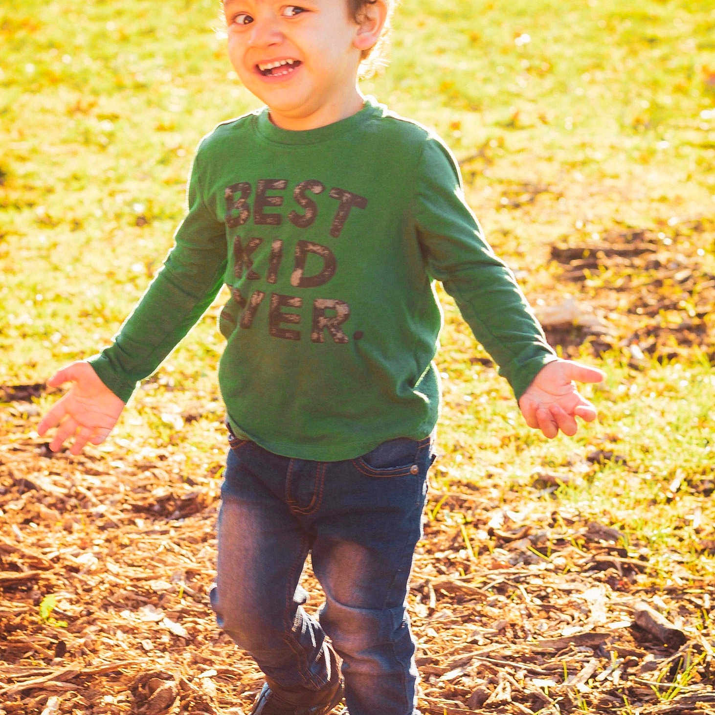 Logan joined the competition — help win amazing prizes! child, fun, green, happy, joy, people_in_nature, person, play, smile, soil, standing, summer, sunlight, t_shirt, toddler