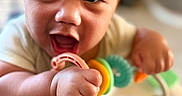 Tamasa joined the competition — help win amazing prizes! baby, child, closeup, colorful, cute, expression, face, focus, hand, happy, head, holding, indoor, infant, person, playtime, skin, smiling, toy, young