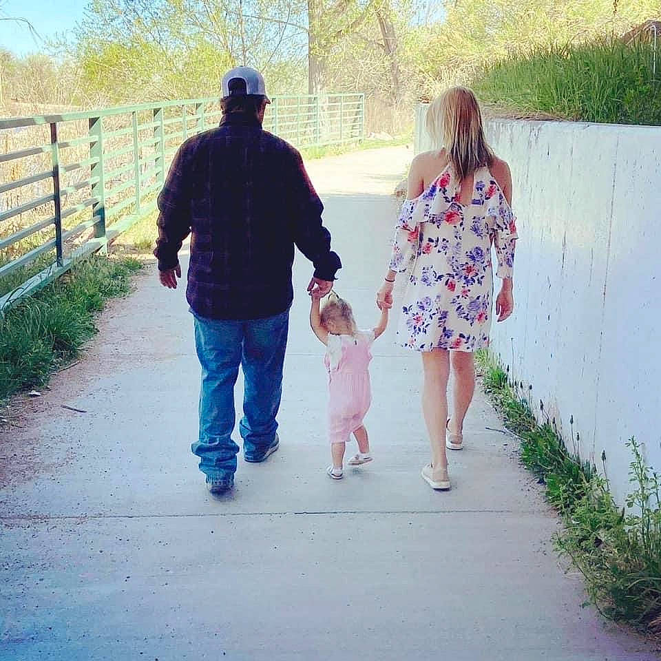 Cashleh Fallon is registered to the contest to win money with this photo: child, fence, footwear, friendship, fun, gesture, grass, happy, holding_hands, interaction, leg, leisure, people_in_nature, person, plant, recreation, standing, summer, sunlight, toddler
