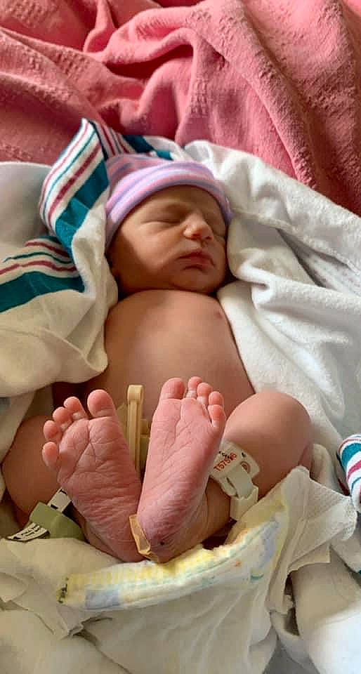 Josie Ann is registered to the contest to win money with this photo: abdomen, baby, baby_sleeping, comfort, facial_expression, finger, foot, gesture, hand, headwear, human_body, human_leg, joint, leg, mouth, nail, person, service, skin, stomach
