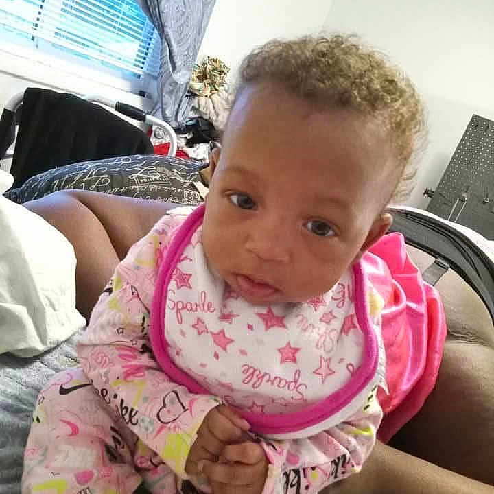 Zyrhinanna joined the competition — help win amazing prizes! baby, child, pajamas, bib, hands, face, indoor, bed, window, curtains, person, clothing, expression, curious, skin, hair, room, furniture, blanket, casual