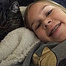 Eddie joined the competition — help win amazing prizes! child, cat, tabby_cat, blanket, smile, braces, face, closeup, cozy, indoor, friendship, comfort, fur, resting, cute, snuggle, young, happy, apparel, texture