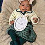 Emilia is registered to the contest to win money with this photo: baby, smiling, headband, bow, sweater, skirt, tights, blanket, infant, couch, portrait, cute, child, happy, indoor, soft, cozy, sign, clothing, person