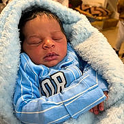 Bowden joined the competition — help win amazing prizes! baby, blanket, blue_blanket, blue_clothing, child, cozy, cute, face, furniture, hands, home, indoor, infant, newborn, peaceful, portrait, resting, sleeping, soft_texture, wrapped