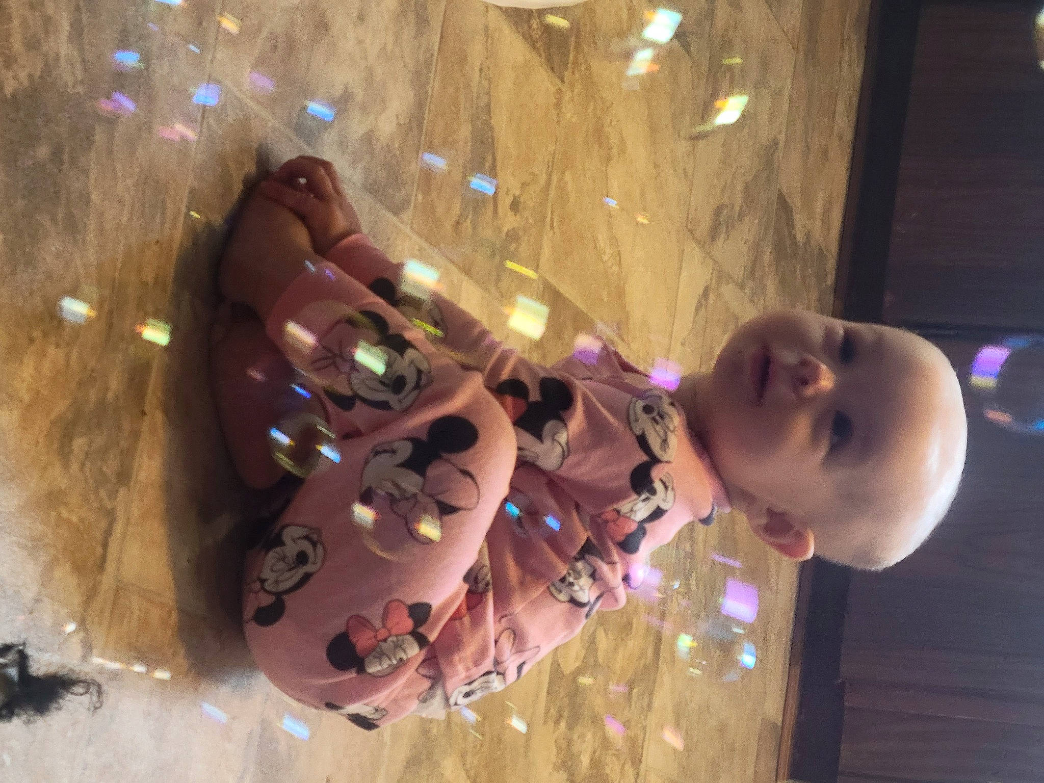 Kynnidi is registered to the contest to win money with this photo: baby, ceiling, child, christmas_ornament, event, fashion_accessory, fun, glass, happy, leisure, magenta, nail, ornament, party_supply, person, plant, play, purple, space, toddler