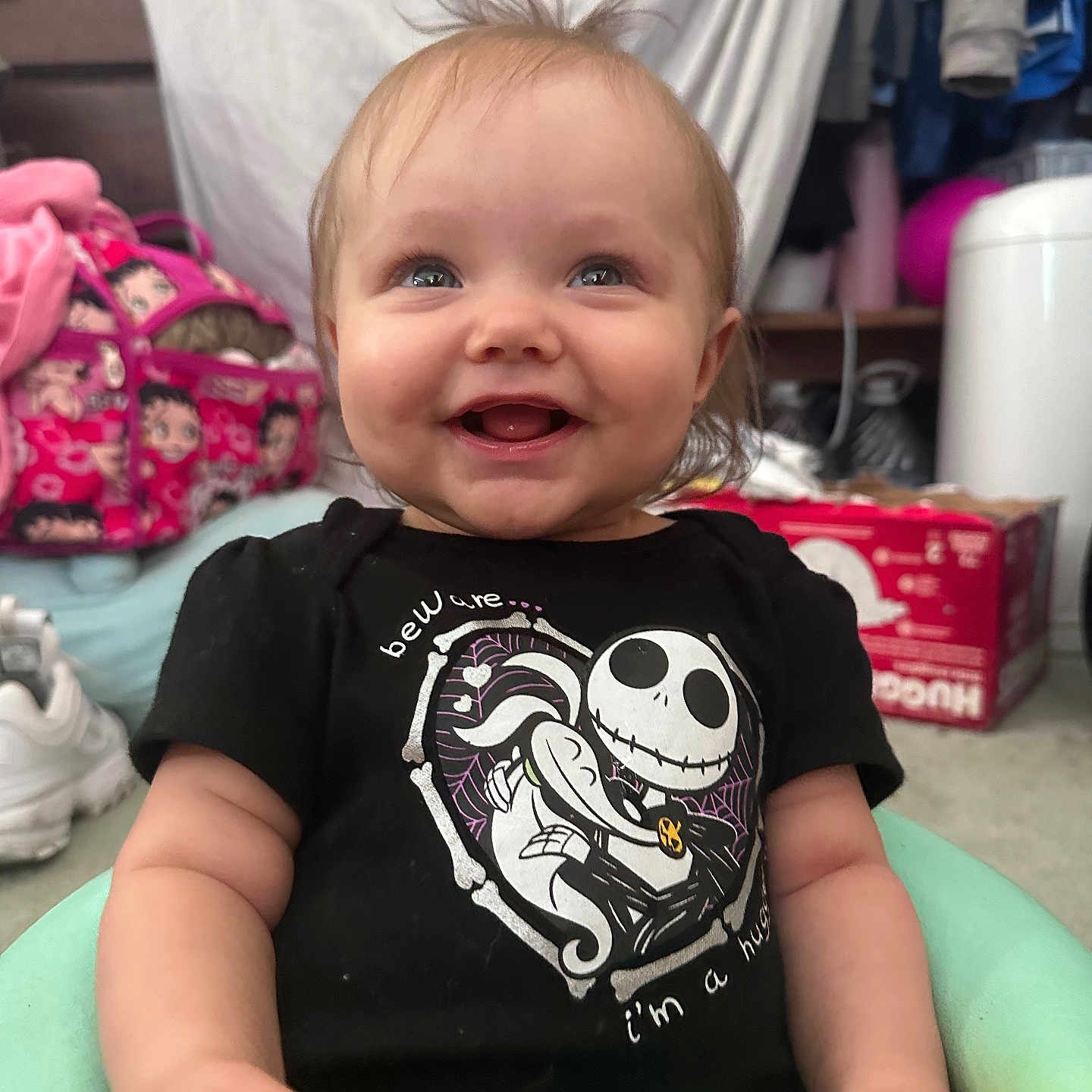 Lydia joined the competition — help win amazing prizes! baby, babylaughing, bodypart, box, clothing, face, footwear, furniture, happy, head, laughing, mouth, person, photography, portrait, shoe, sitting, smile, t_shirt, teeth