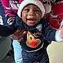Ayden participe au concours pour gagner de l'argent avec cette photo : baby, child, smiling, santa_hat, reindeer_sweater, holiday, festive, adult_hand, holding, indoor, person, clothing, jeans, cheerful, cute, happy, portrait, celebration, christmas, seasonal