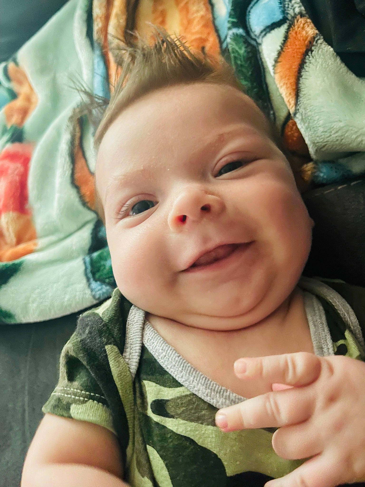 Waylon is registered to the contest to win money with this photo: baby, cheek, chin, eye, eyebrow, face, gesture, happy, head, iris, lip, mouth, nose, person, photograph, product, skin, sleeve, smile, textile