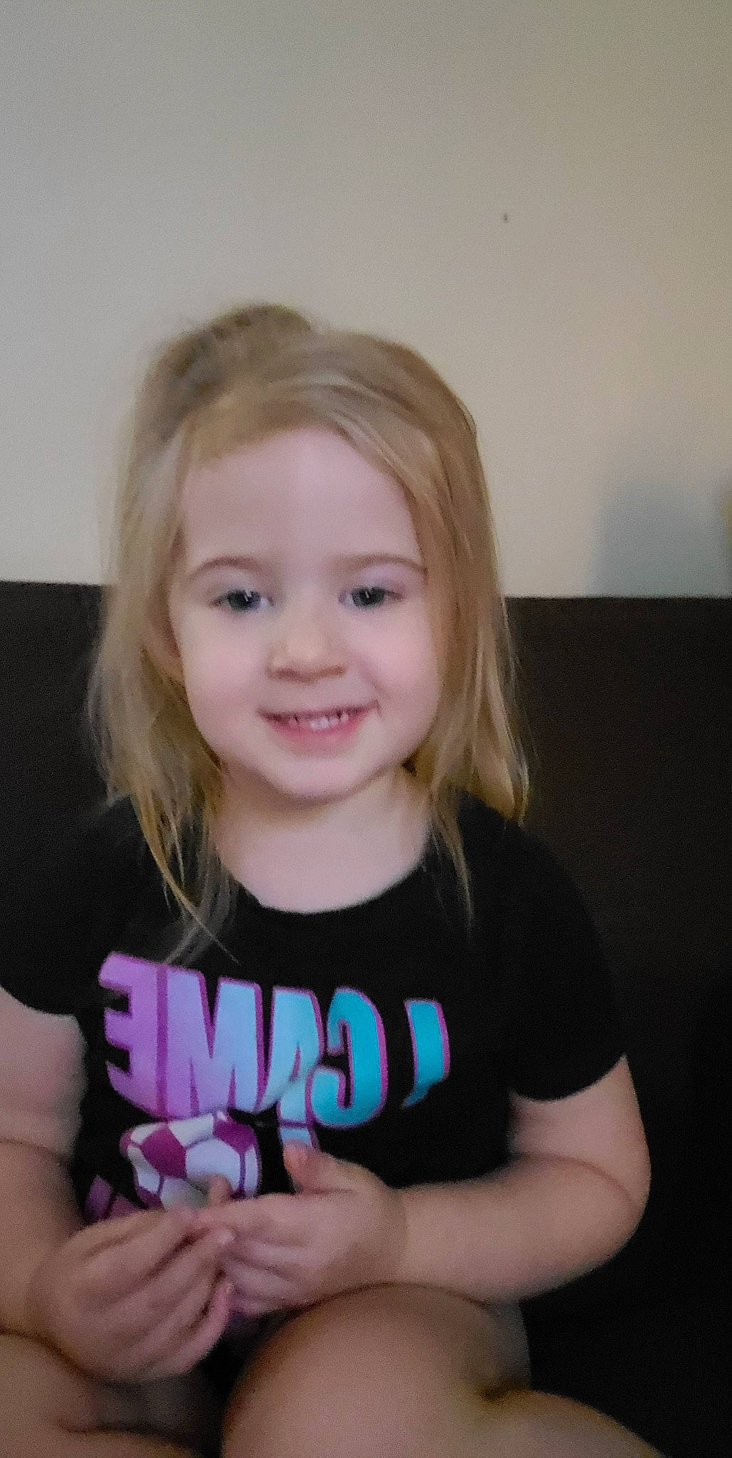 Paisley is registered to the contest to win money with this photo: arm, baby_toddler_clothing, cheek, cool, eyelash, face, finger, gesture, hair, hand, happy, head, iris, joy, lip, neck, person, skin, sleeve, smile