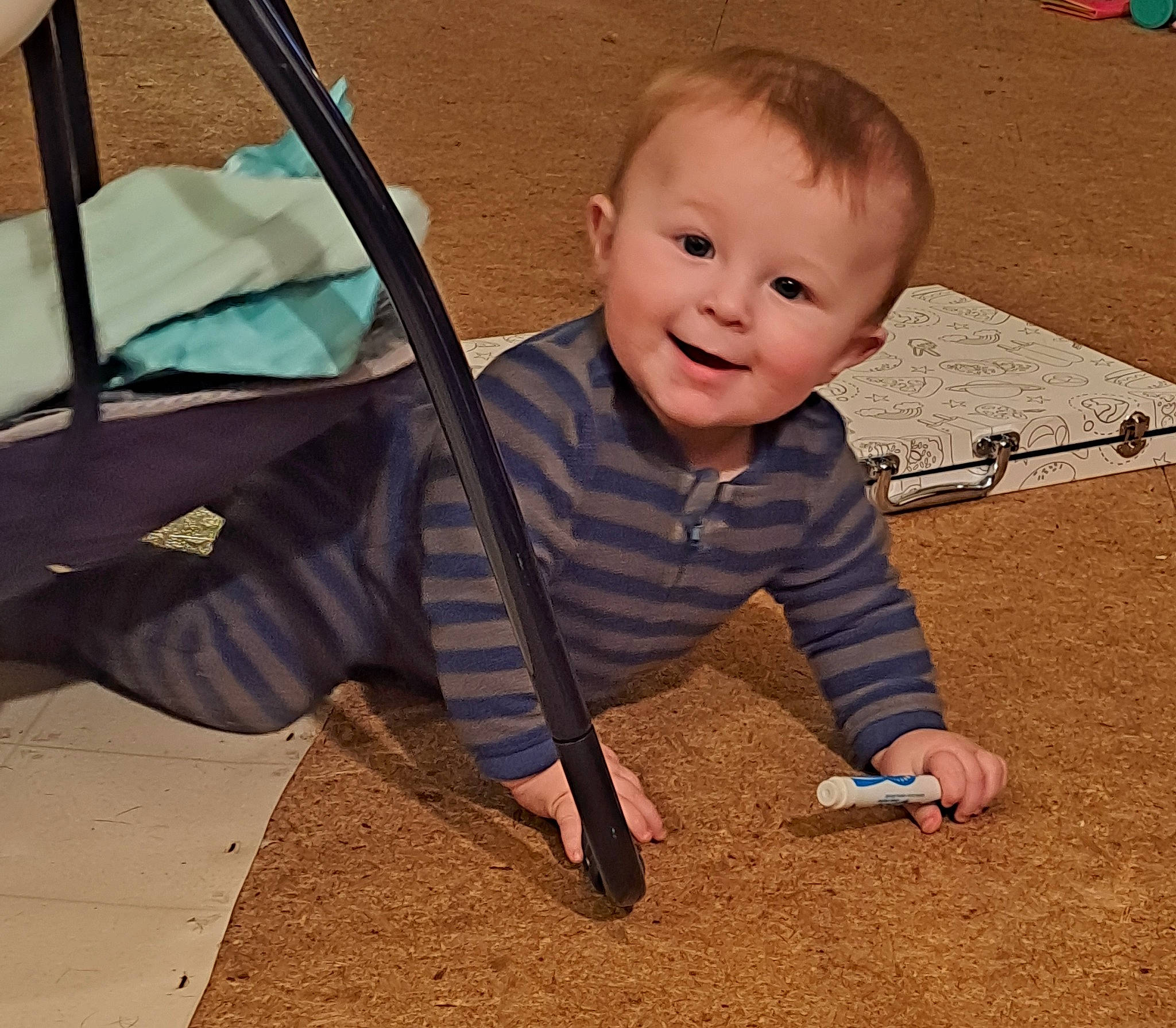 Zayn is registered to the contest to win money with this photo: baby, baby_toddler_clothing, child, flooring, fun, grass, happy, human_body, joy, leisure, outdoor_play_equipment, person, road_surface, sitting, smile, soil, swing, t_shirt, tints_and_shades, toddler