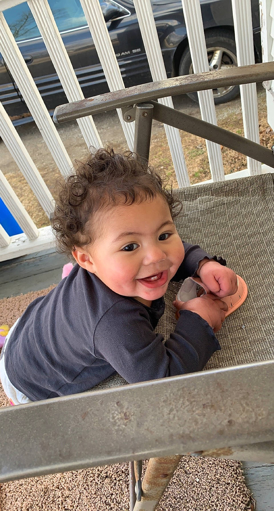 Khalani is registered to the contest to win money with this photo: baby_toddler_clothing, child, city, eye, face, fun, grass, happy, leisure, person, sitting, skin, smile, soil, t_shirt, thumb, toddler, tree, vacation, window