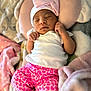 Terryana joined the competition — help win amazing prizes! baby, newborn, sleeping, pink, heart_pattern, onesie, hat, bow, blanket, cushion, soft, cozy, infant, resting, cute, child, clothing, hands, face, portrait