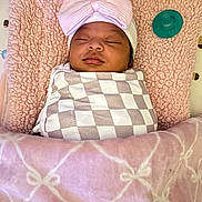 Terryana joined the competition — help win amazing prizes! baby, sleeping, swaddled, blanket, pink, bow, hat, pillow, pacifier, nursery, infant, face, closed_eyes, cute, child, soft, pattern, cozy, resting, toddler