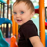 Renely joined the competition — help win amazing prizes! toddler, child, playground, smiling, blue_eyes, short_hair, black_shirt, outdoor, daylight, play_equipment, slide, orange_pole, blue_slide, happy, person, young_child, cute, fun, recreation, park