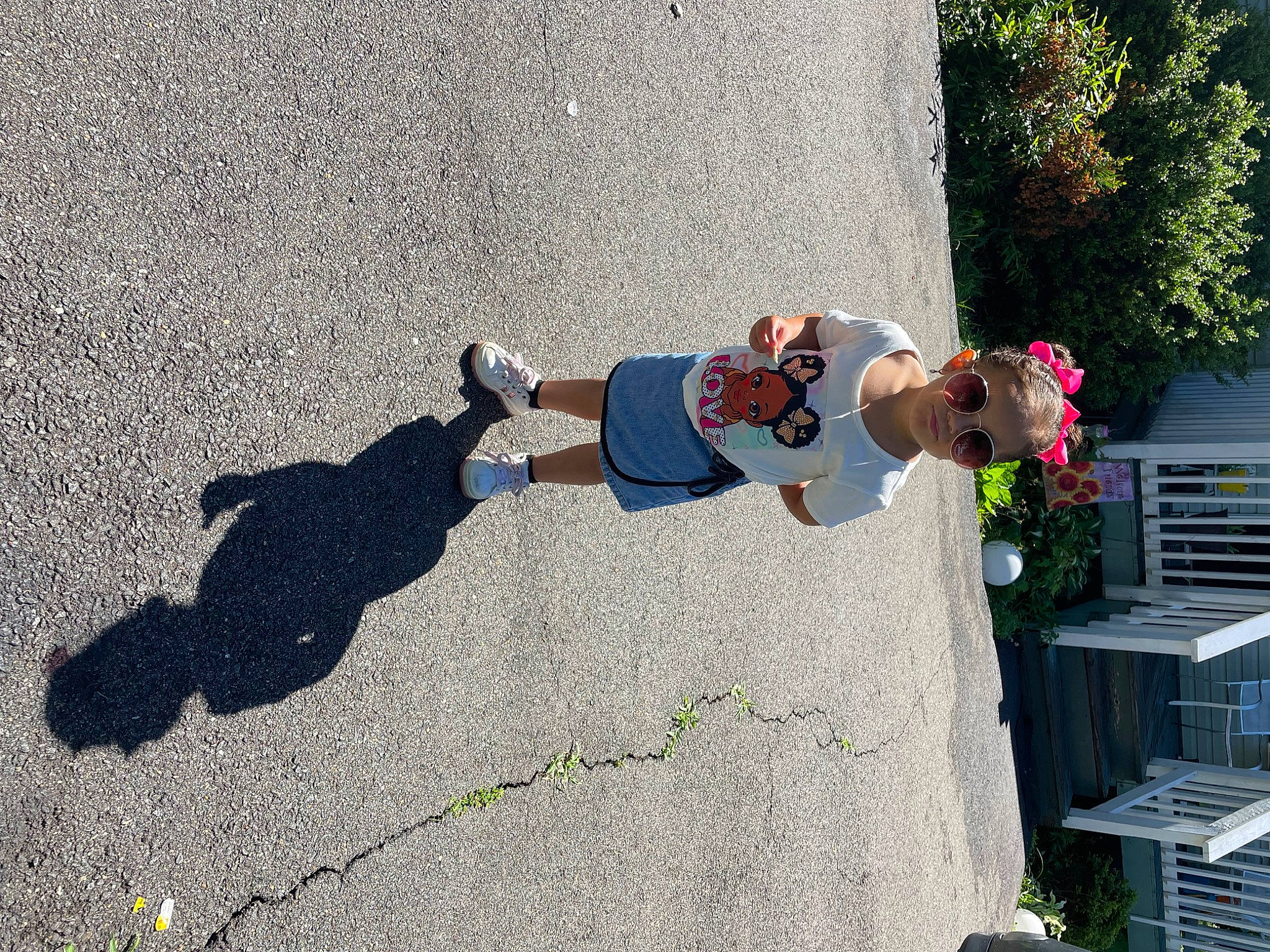 Elani joined the competition — help win amazing prizes! asphalt, concrete, footwear, fun, grass, hat, houseplant, landscape, leisure, person, plant, recreation, road_surface, shadow, sidewalk, soil, tar, toddler, tree, walking_shoe