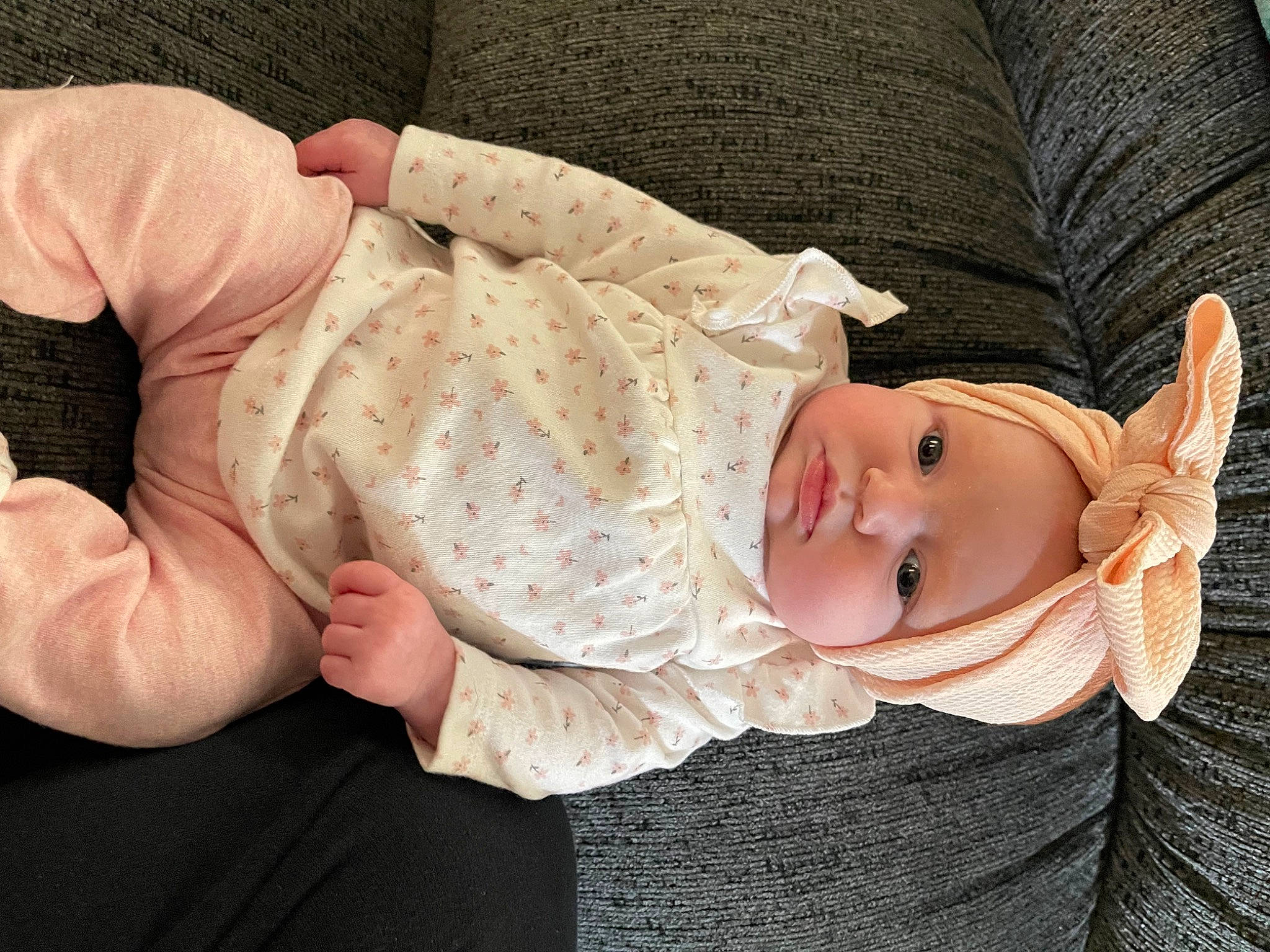 Madelynn joined the competition — help win amazing prizes! abdomen, arm, baby, baby_toddler_clothing, child, comfort, eye, finger, gesture, glasses, hand, hat, headwear, human_body, nail, person, sitting, skin, sleeve, toddler